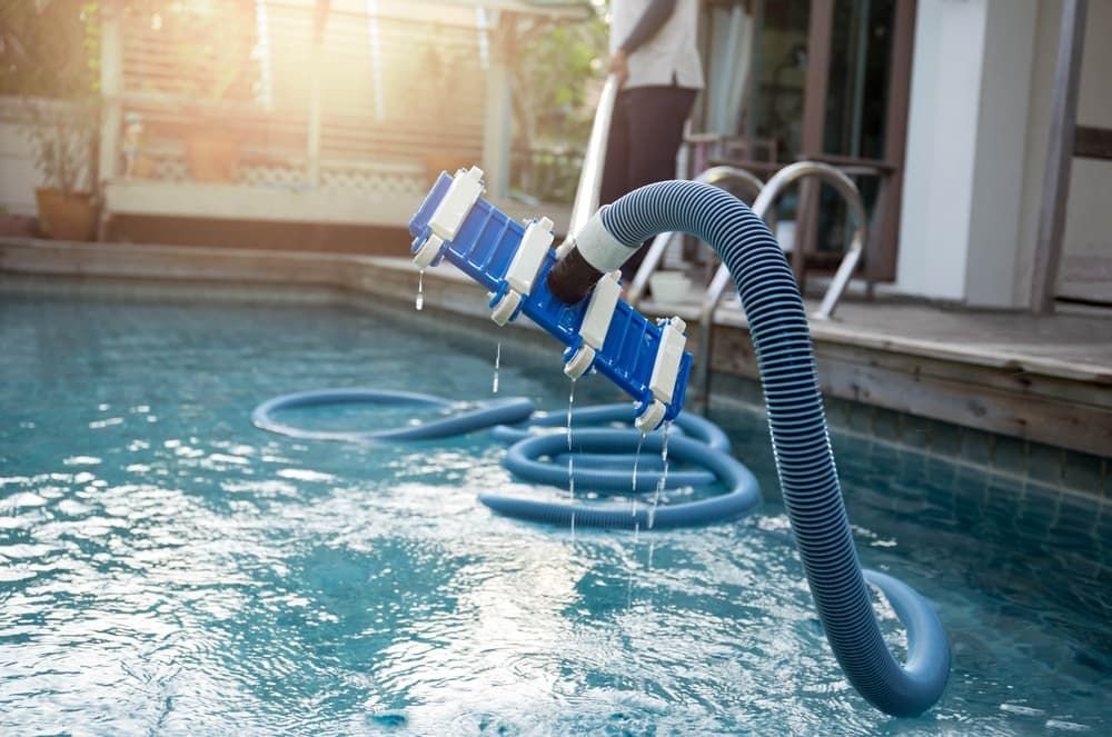 Pool pump repair technician servicing a pool in Coto De Caza.